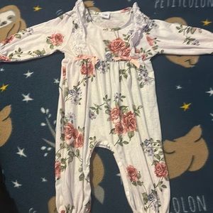 Long sleeve white romper with flowers on it. Size 9-12 months